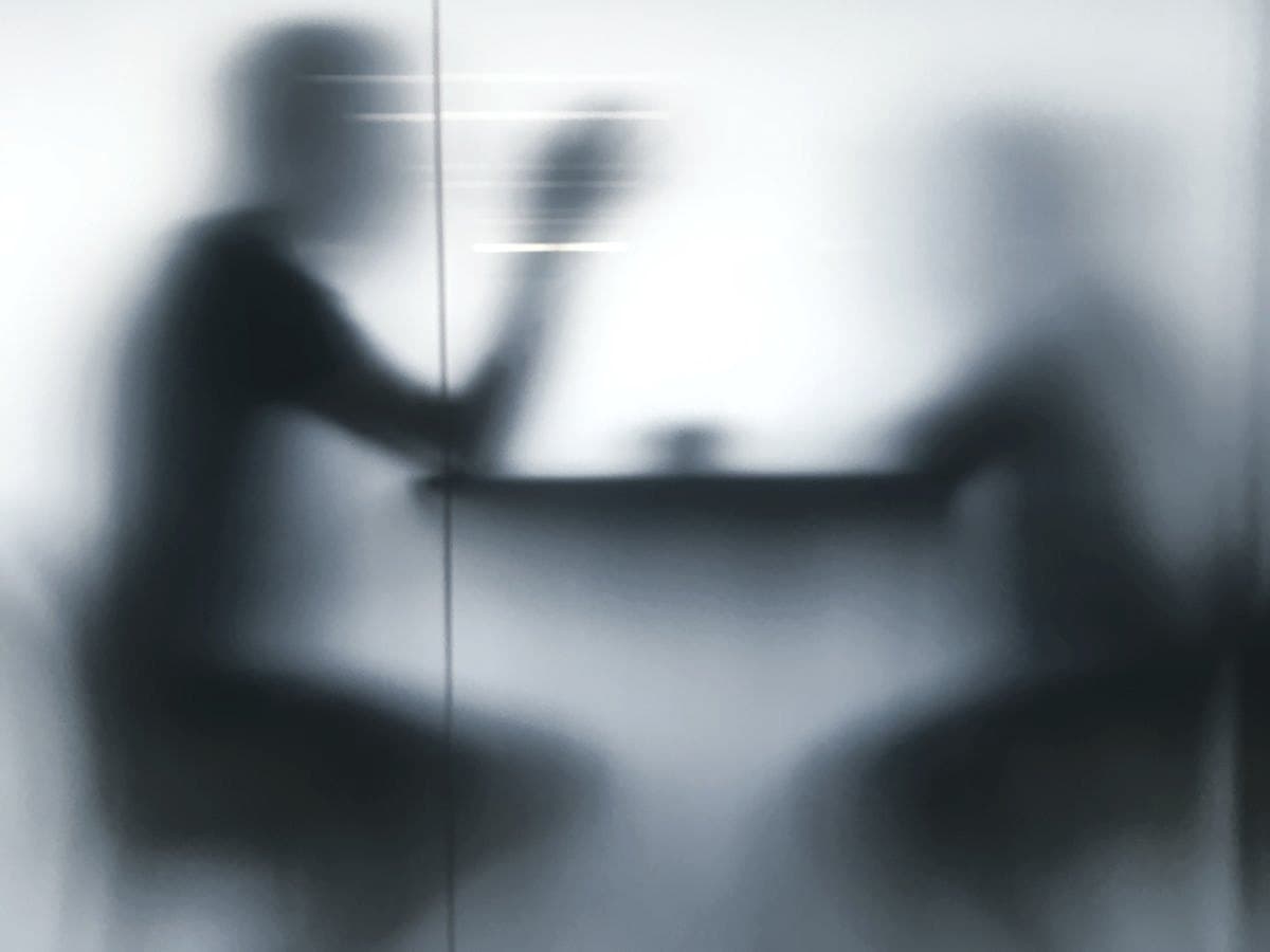 Two figures in motion, silhouetted — the AI Act as a trust test