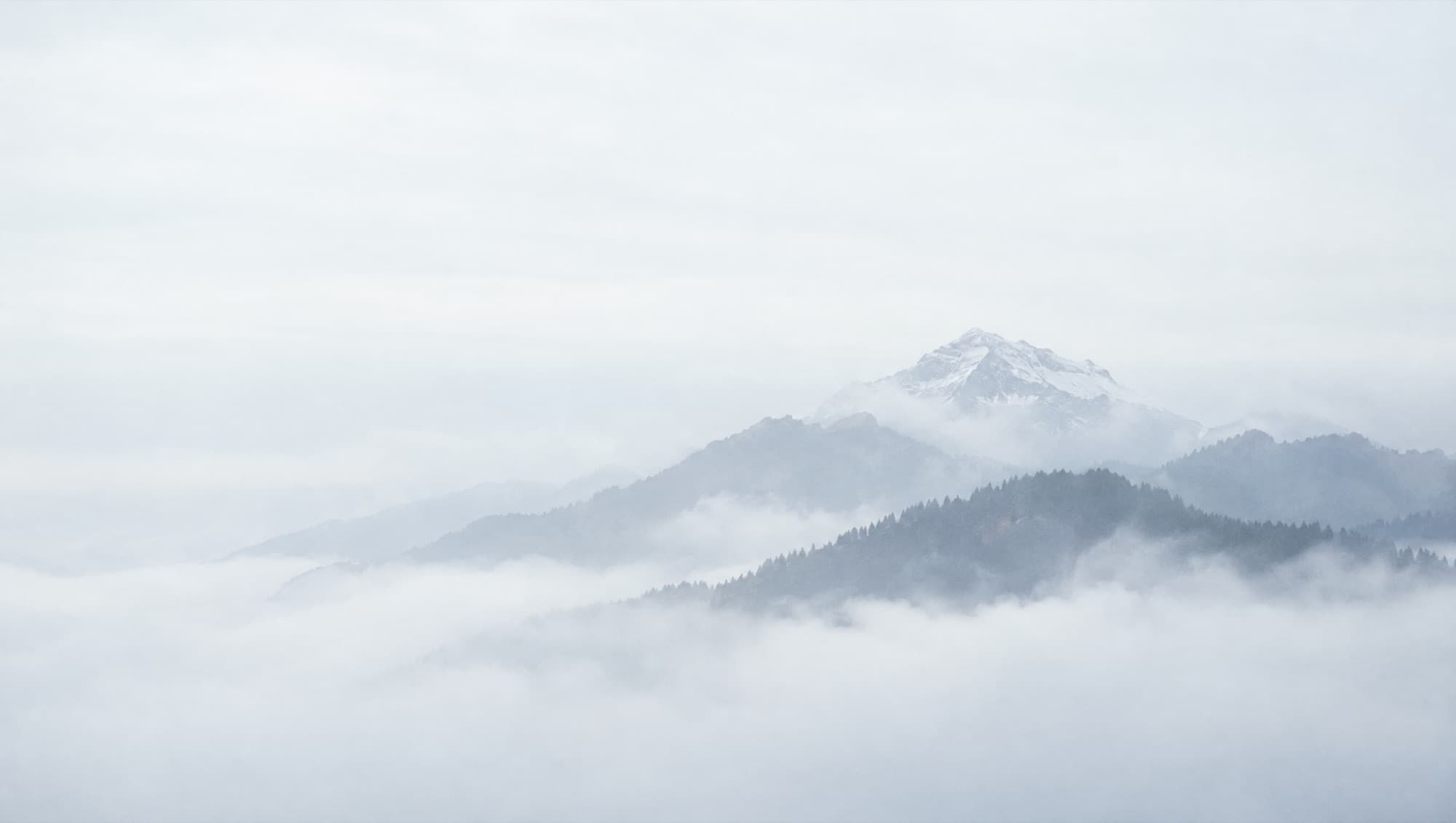 Alpine ridges in layered cloud